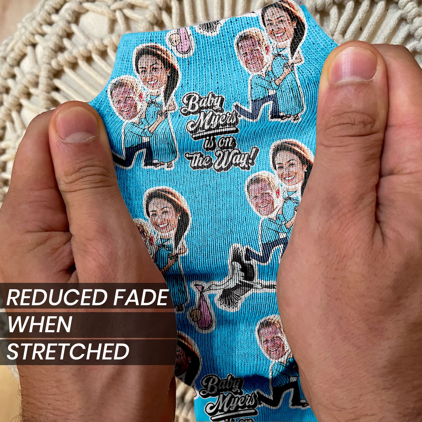 baby shower gifts personalized socks with faces of new parents stretched to show durability and print quality